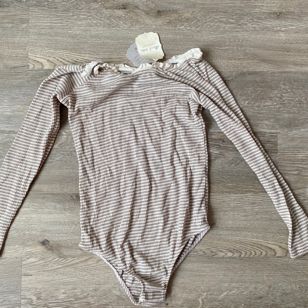 Striped body suit with lace detail.